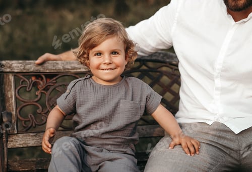 Preview: Cheerful child and crop father in park