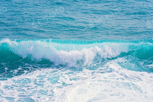 Preview: Beautiful blue aquamarine rolling waves with splash and foam. Summer background texture