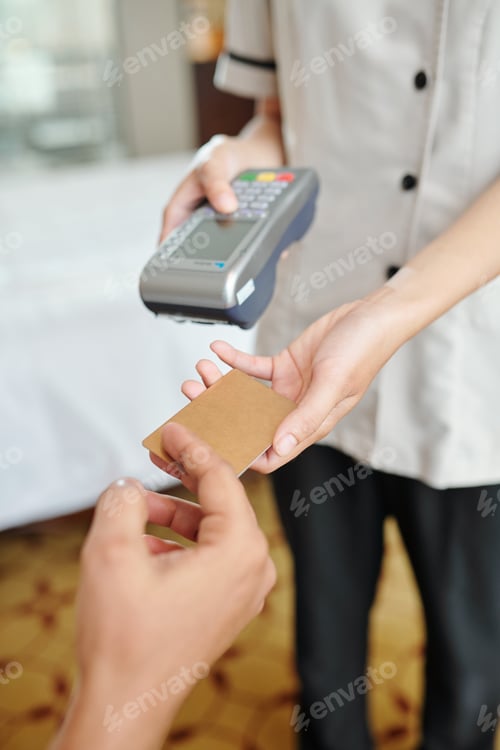 Preview: Hotel maid with payment terminal