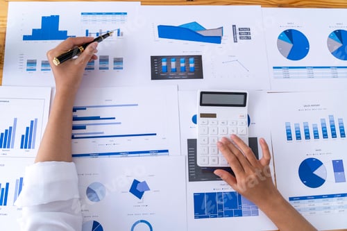 Preview: businesswoman working on desk office with using a calculator to calculate the numbers, calculating m