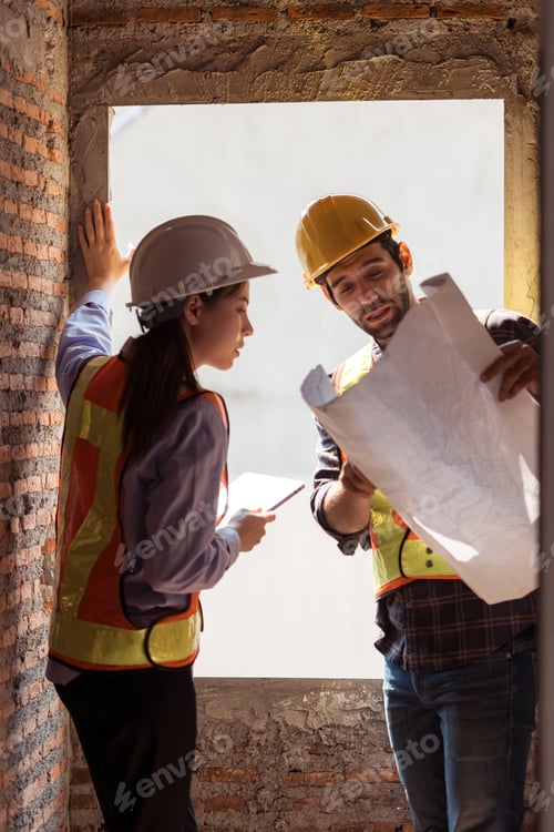 Preview: Architects and engineers work together to assess the residential home construction site's progress