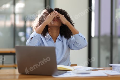 Preview: African woman in office stressed pressure of overwork.