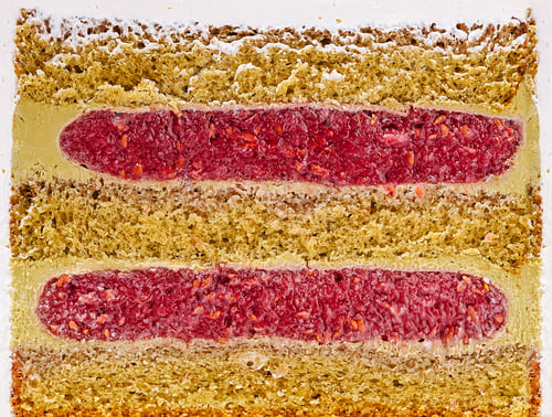 Preview: Delicious layered cake with vibrant berry filling in a dessert setting
