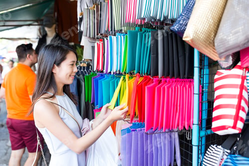 Preview: Woman shopping in weekend market