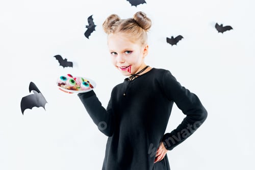Preview: Little Girl Witch In Black Dress Over Magical Accessories. Halloween, The Studio Evening.