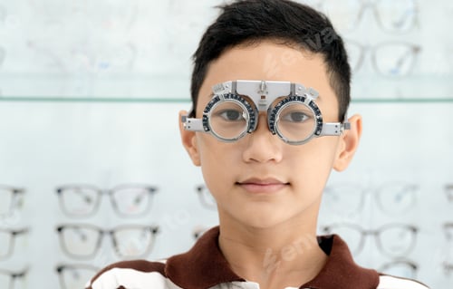 Preview: Boy has his eyes checked for glasses by a specialist.