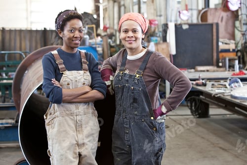 Preview: Black women team of factory workers in a sheet metal factory.