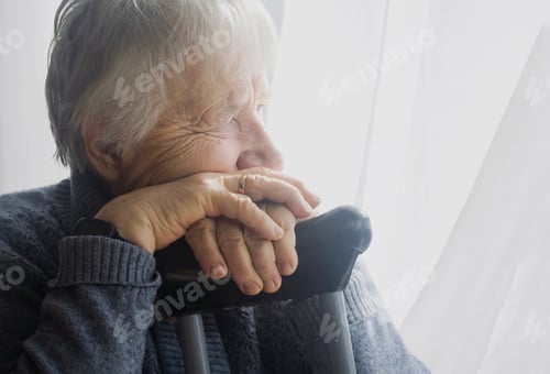 Preview: An old woman with gray hair sadly