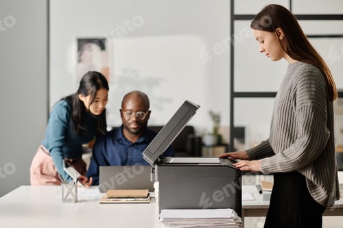 Preview: Young Woman Making Copy Of Document