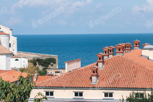 Preview: Red Roofs with chimneys and Blue Sea in Coastal Town of Piran, Slovenia