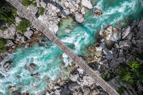 Preview: Suspension bridge in Soca valley over Soca river in Slovenia, top down drone view