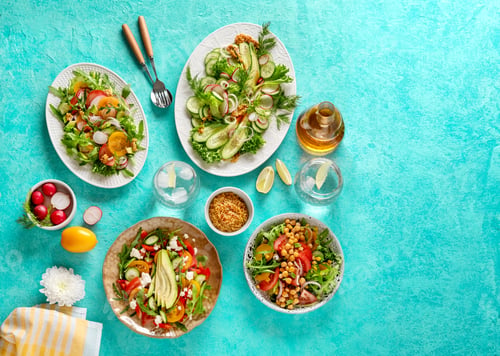 Preview: Summer healthy vegetables salads with avocado, cucumber, radish, bell pepper and tomato.