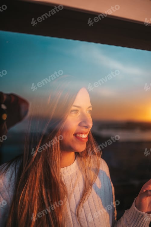 Preview: Young woman behind a window
