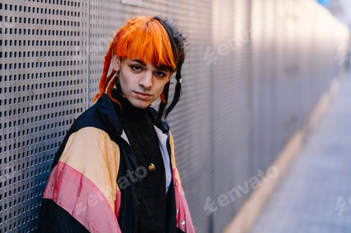 Preview: Portrait of young guy with painted hair.