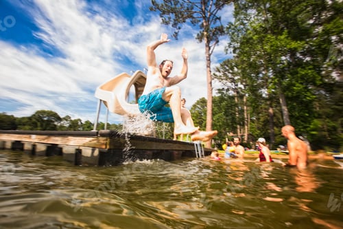 Preview: Man jumping from pier slide at Jackson Lake, Georgia, USA
