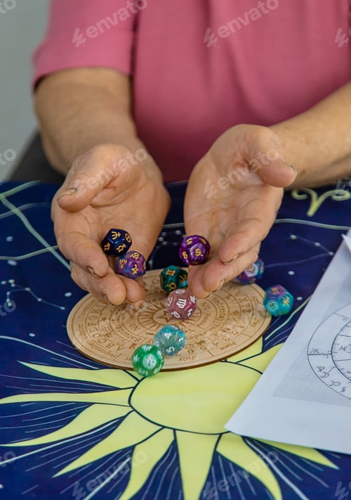Preview: Woman numerologist astrologer counts numbers. Selective focus. People.
