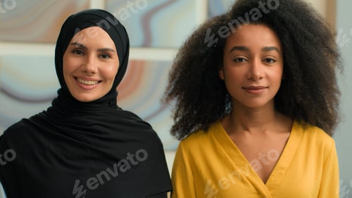 Preview: Two diverse business women girls multiracial female businesswomen African American colleagues