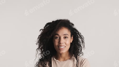 Preview: Portrait of cheerful African American woman with dark fluffy hai