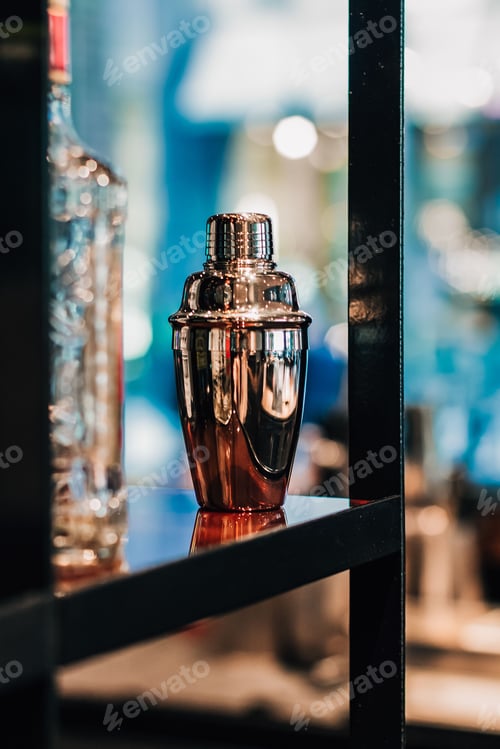 Preview: Vertical shot of a cocktail shaker on a shelf
