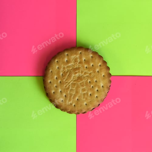 Preview: round chocolate sandwich biscuit or cookie on neon paper square sticky note paper