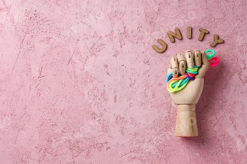 Preview: A knot of colorful laces in a wooden hand. Place for text