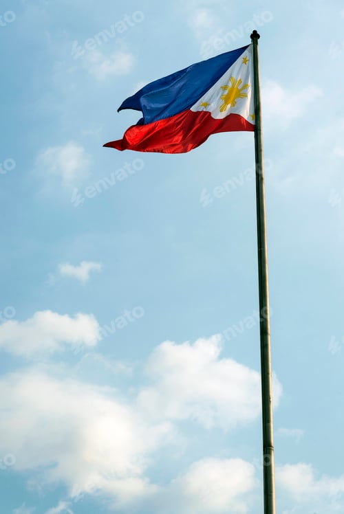 Preview: Philippine Flag Waving Proudly Against a Blue Sky