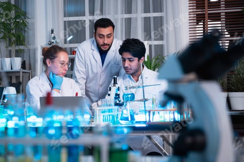 Preview: A group of young scientists are conducting experiments in the lab using a microscope.