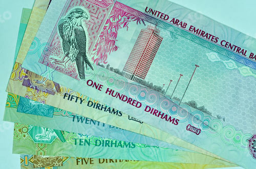 Preview: Top view shot of United Arab Emirates currency, dirhams isolated on a white background