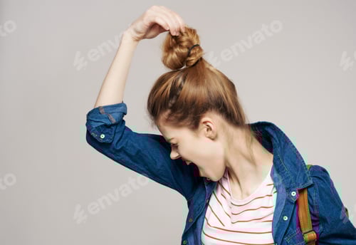 Preview: Young Woman Puts Her Hair Up Angrily
