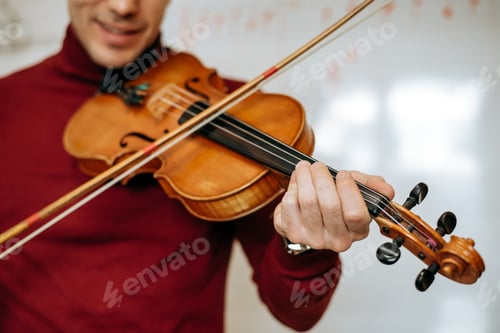 Preview: Man playing violin in studio