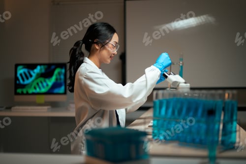 Preview: Scientist researching DNA genetics with test tube pipette