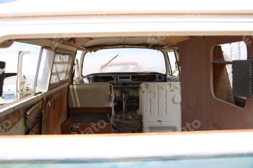 Preview: Inside of an old rusty broken beach vagon with worn out cabin seats