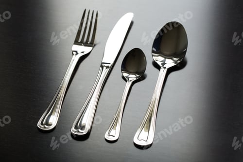 Preview: Cutlery on a black background. Fork, spoon, knife