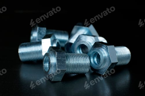 Preview: Close-up of several chrome metal bolts