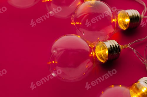 Preview: Beautiful illuminated festive light bulbs garland close up