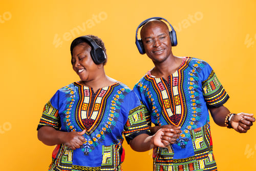 Preview: Couple enjoying music in headphones