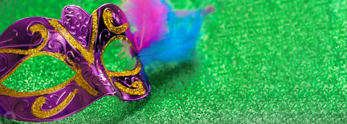 Preview: Purple carnival mask on green shiny background. Mardi Gras or Fat Tuesday symbol.