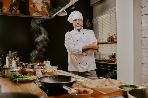 Preview: Portrait of Middle Aged Man Chef Leading Cooking Class in Kitchen