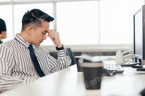 Preview: Stressed male employee feel pain eyestrain working on computer.