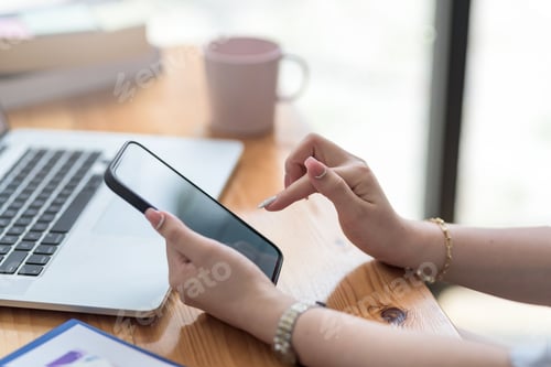 Preview: Woman using mobile phone to send text , work or play social media.