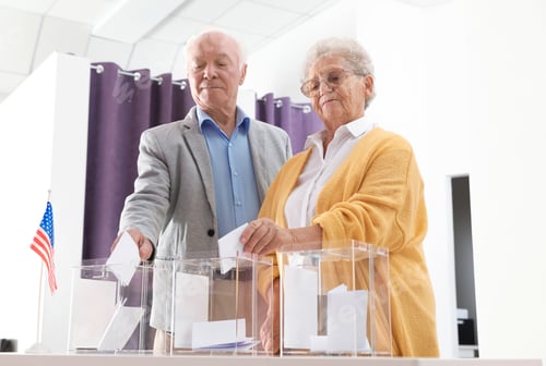 Preview: Elderly people putting ballot papers into boxes at polling station