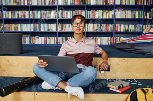 Preview: Young Asian Man in Library