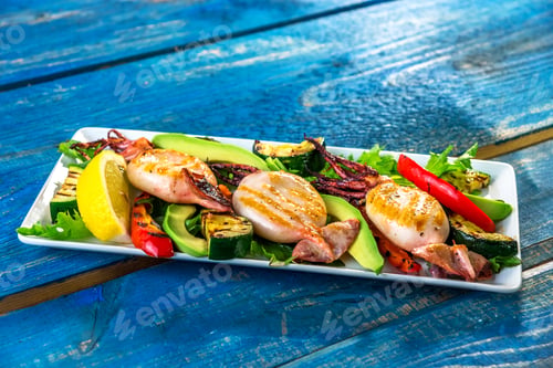 Preview: Grilled squids with vegetable on wooden background
