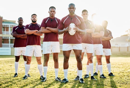 Preview: Rugby, grass and portrait of men, team with ball and standing together with confidence for winning