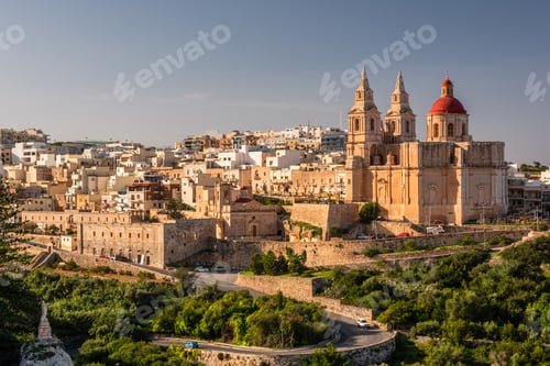 Preview: Il-Mellieha, Malta - Mellieha town at sunny day with Paris Church on hill top