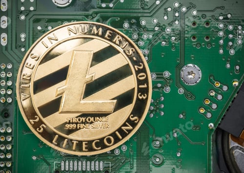 Preview: Gold metallic litecoin on electronic circuit motherboard.crypto currency
