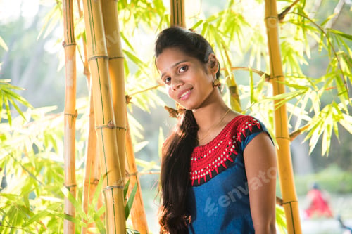 Preview: Happy smiling girl in bamboo forest.