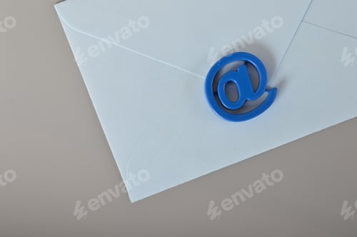 Preview: Blue envelope and email address symbol. Email marketing and email communication concept.