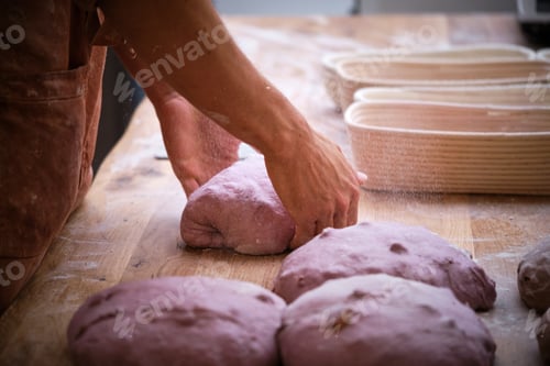 Preview: Photo detail of a baker's hands working the bread dough