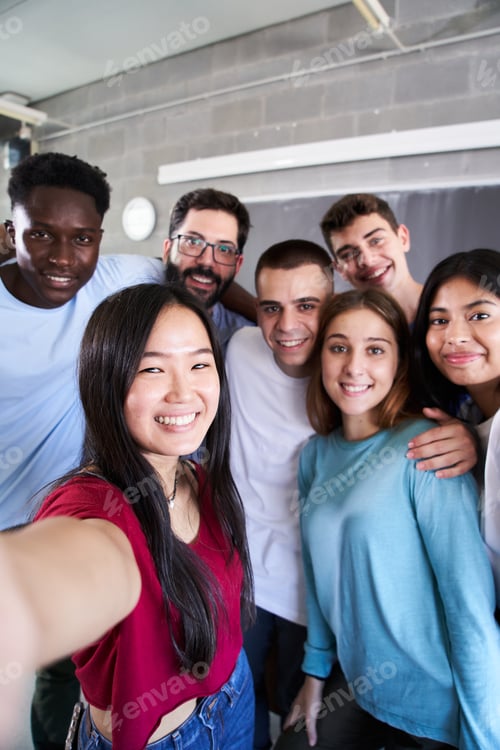 Preview: Vertical photo of a multiracial group of friends taking a selfie - concept of normal friendship